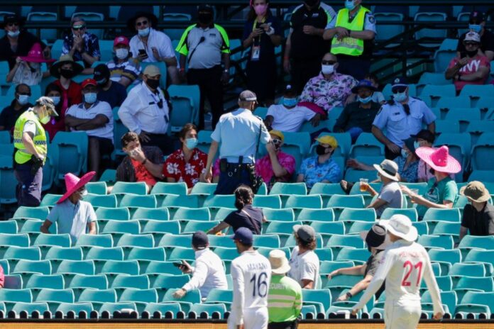 NSW police taking the six spectators out of the park
